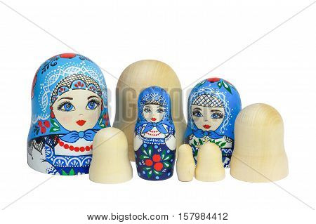 Three traditional Russian matryoshka dolls and blanks for painting dolls. Clean matryoshka.