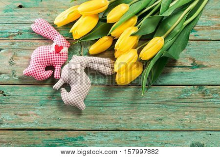 Easter Background Yellow Tulips On Wooden Table, Rabbit, Eggs,nest Candy