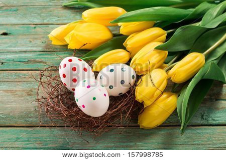 Easter Background Yellow Tulips On Wooden Table, Rabbit, Eggs,nest Candy