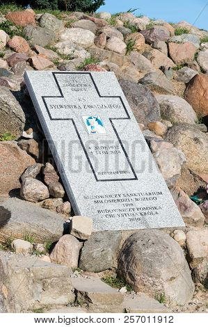 Swiebodzin, Poland - August 19, 2018: Stone Plaque To Priest Sylwestra Zawadzka Of Statue Of Christ 