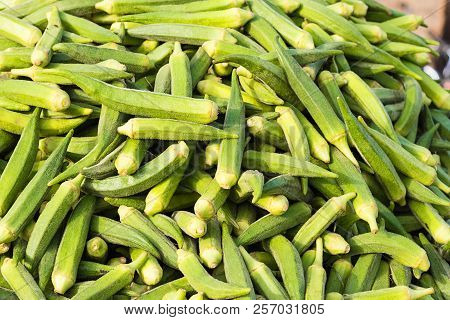 Fresh Organic Ladyfinger On Market, Agriculture And Food Concept, Background