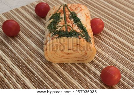 Cheese With Paprika. Homemade Suluguni. Cheese Roll With Cherry Tomatoes.
