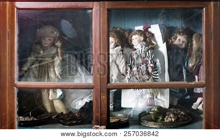 Old Girl Toy Collection In Wood Shelf