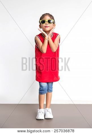Asian Kid With Sport Shirt And Sun Glasses Fashion Jumping Action