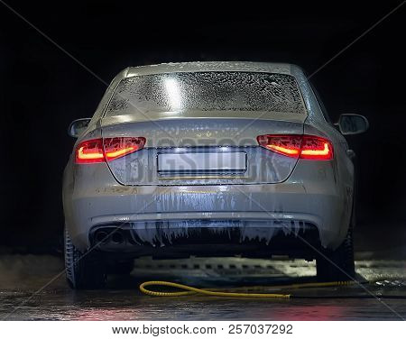 Car Covered With Foam On Car Wash