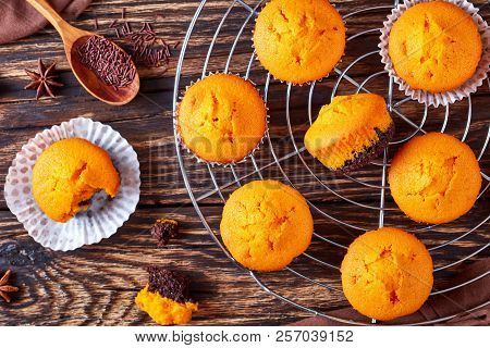 Freshly Baked Delicious Sweet Pumpkin Muffins On A Rustic Wooden Table, Delicious Autumn Dessert For