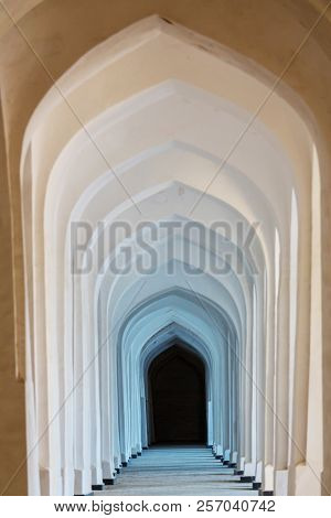 White Arabian arches in Kolon mosque. Bukhara. Uzbekistan. Central Asia.