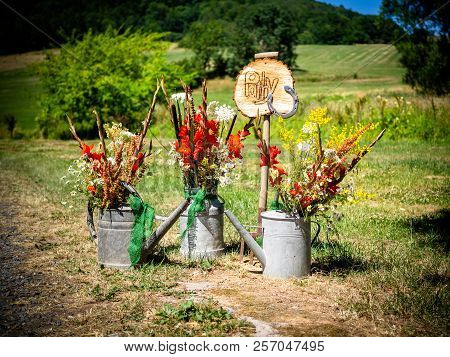 The Sign For The Party With Flowers And Watering Can In Summer And Spring Autumn