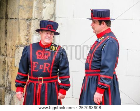 London, United Kingdom - June 09, 2013: Beefeaters Near Walls Of The Tower Of London. Beefeaters Or 
