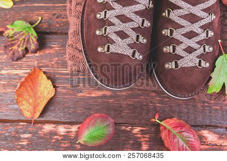 Brown Man Suede Boots With Sweater On Wooden Background