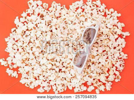 Background. Popcorn On A Bright Red Background. 3d Glasses For Watching A Movie, Top View. Copyspace
