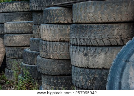 Worn Wheels Stacked By A Tire Shop
