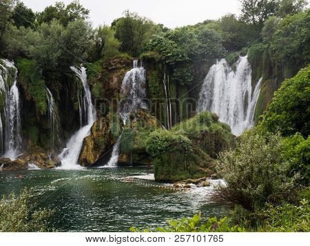 Beautiful Kravica Waterfall In Bosnia And Herzegovina - Popular Swimming And Picnic Area For Tourist