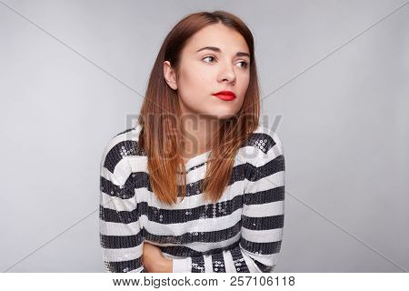 Scared Woman Notices Something Terrifying Aside. Exhausted Female Trembles And Feels Cold, Hugs Hers