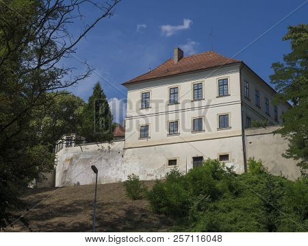 Czech Republic, Horky Nad Jizerou, July 28, 2018: View On Baroque Castle, Green Trees And Blue Sky B