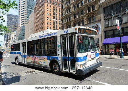 New York City - May 7, 2013: Mta Hybrid Electric Bus Route 5 On Fifth Avenue At 42nd Street, New Yor