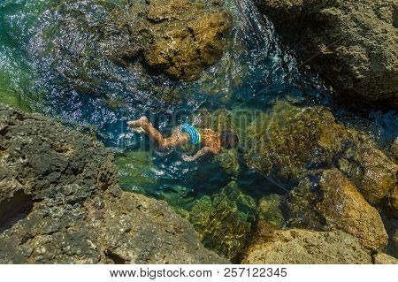 Boy Swimming Underwater, Beautiful View Of Crystal Clear Transparent Water Of Sea