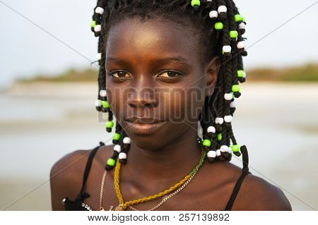 Orango Island, Guinea-bissau - February 2, 2018:  Portrait Of A Beautiful Young Girl At The Beach In