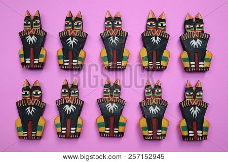 Wooden Cat With A Red Background, Funny