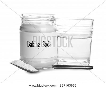 Glass Of Water, Jar With Baking Soda And Spoon On White Background