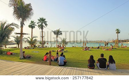La Mer In Dubai, Uae - May 06, 2018: People Rest On The Beach At Sunset. It Is A New Beachfront Dist