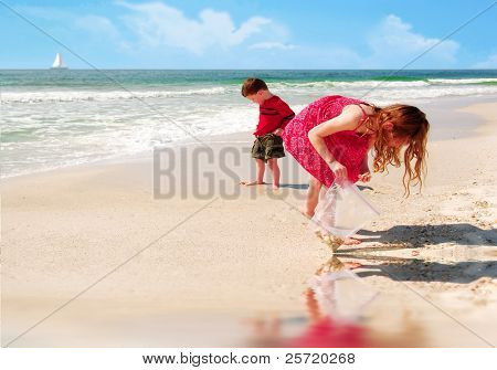 Young girl and boy collecting shells at pretty beach