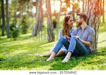 Lovely University Students Studying Outdoors In Park