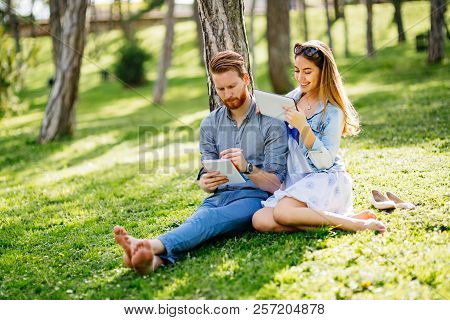 Lovely University Students Studying Outdoors In Park