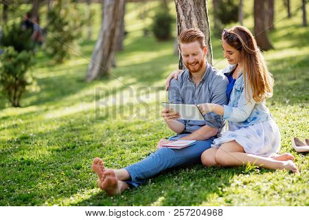 Lovely University Students Studying Outdoors In Park