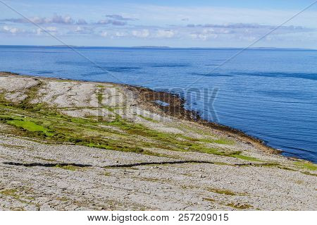 Fanore Beach In Burren Mountain With Aran Islands In Background