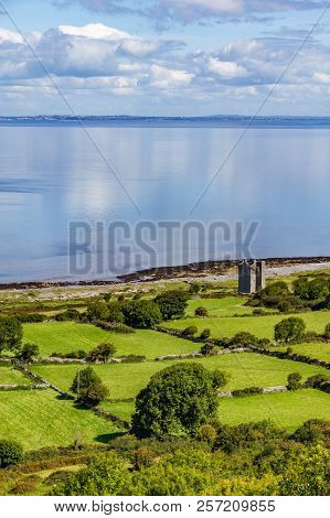 Old Rock Tower, Farm And Beach In Ballyvaughan
