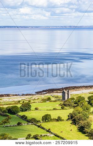 Old Rock Tower, Farm And Beach In Ballyvaughan