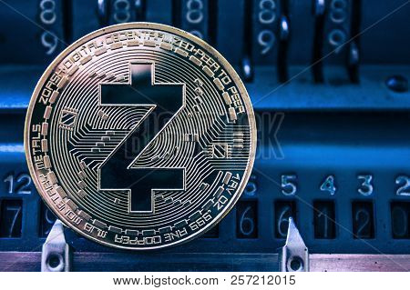 Coin Cryptocurrency Zcash On The Background Of Numbers Of The Arithmometer. Concept Mining Or Zcash 