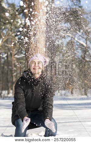 Girl Throws Snow Up. Portrait Of The Beautiful Girl Throwing Snow In The Winter. Happy Young Woman P