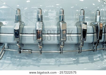 The Power Belt Of A Powerful Chemical Reactor. The Parts Of The Reactor Are Connected By Steel Locks