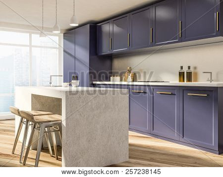 Stylish Kitchen Corner With White Walls, Wooden Floor, Purple Countertops And Cupboards And A Stone 