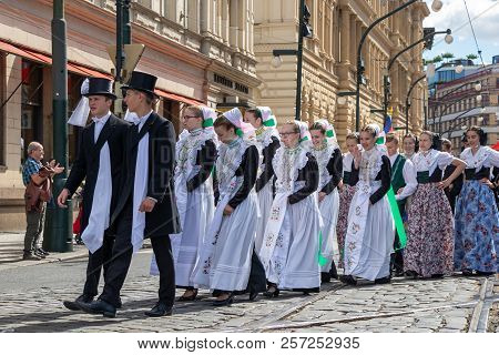 Prague, Czech Republic - July 1, 2018: People In Folk Costumes Parading At Sokolsky Slet, A Once-eve