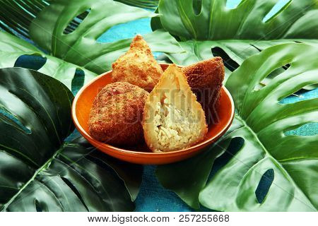 Coxinha Street Food. Brazilian Chicken Coxinha Over Rustic Background.