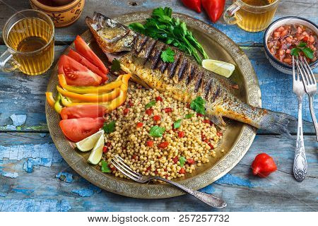 Grilled Sea Bass On Coper Plate, Moroccan Style