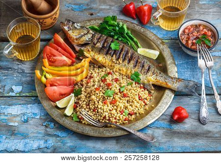 Grilled Sea Bass On Coper Plate, Middle Eastern Style