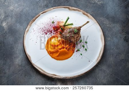 Duck Leg Confit With Batat Puree, Carrots And Couscous, Restaurant Meal