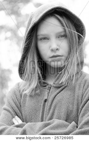 girl in hooded jacket outside