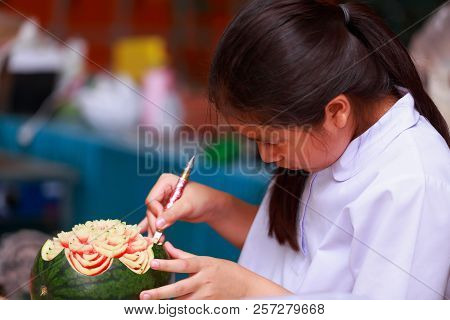 Nakhonratchasima, Thailand - August 31, 2018:asian Little Girl Carve Fruit In School