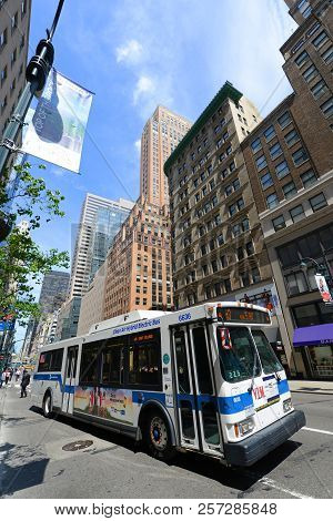 New York City - May 7, 2013: Mta Hybrid Electric Bus Route 5 On Fifth Avenue At 42nd Street, New Yor