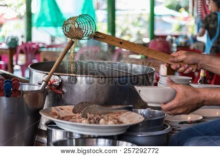 Chef Cooking A Noodle Soup At Street Food Market