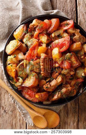 Ojahuri Fried Meat With Potatoes, Tomatoes, Herbs And Spices Close-up On A Frying Pan. Vertical Top
