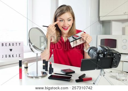 Cheerful Female Vlogger Showing Palette While Recording Video And Giving Advice For Popular Blog. Fa
