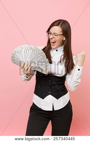 Young Overjoyed Business Woman Screaming, Hold Bundle Lots Of Dollars, Cash Money Doing Winner Gestu