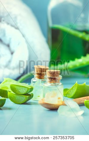 Aloe Vera Extract In A Small Bottle And Pieces On The Table. Selective Focus.