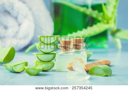 Aloe Vera Extract In A Small Bottle And Pieces On The Table. Selective Focus.